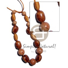 Capsule wrapped wood beads